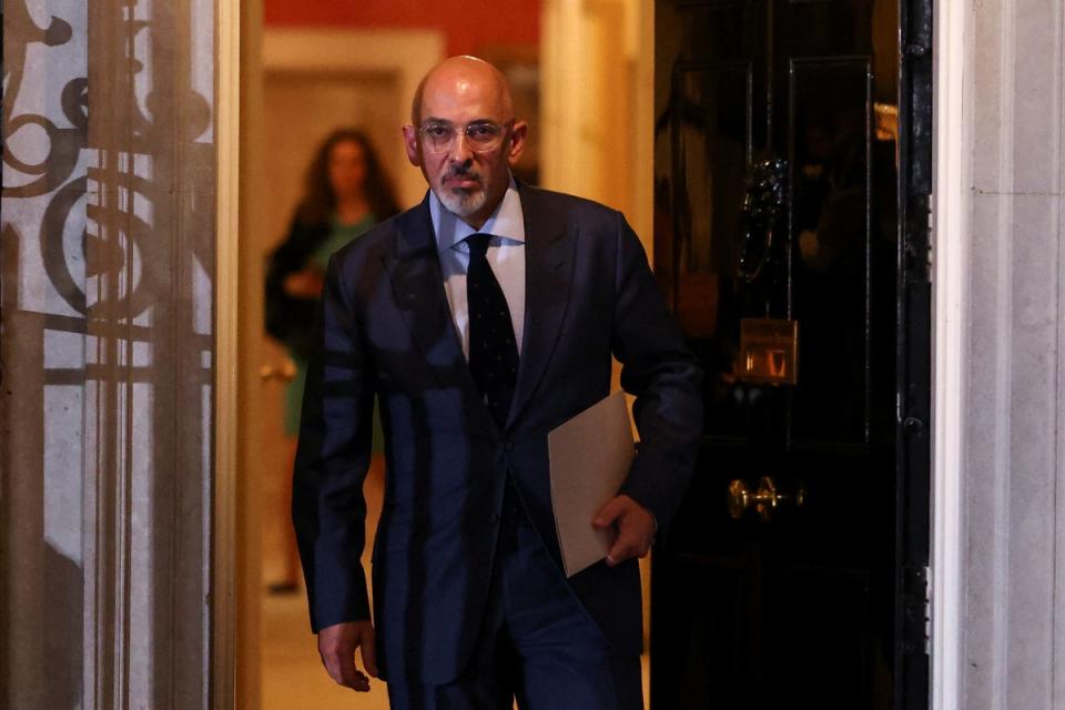 Nadhim Zahawi clutched a brown envelope and remained expressionless as he walked towards a car waiting on Downing Street before pulling away having been made the new Chancellor. (REUTERS)