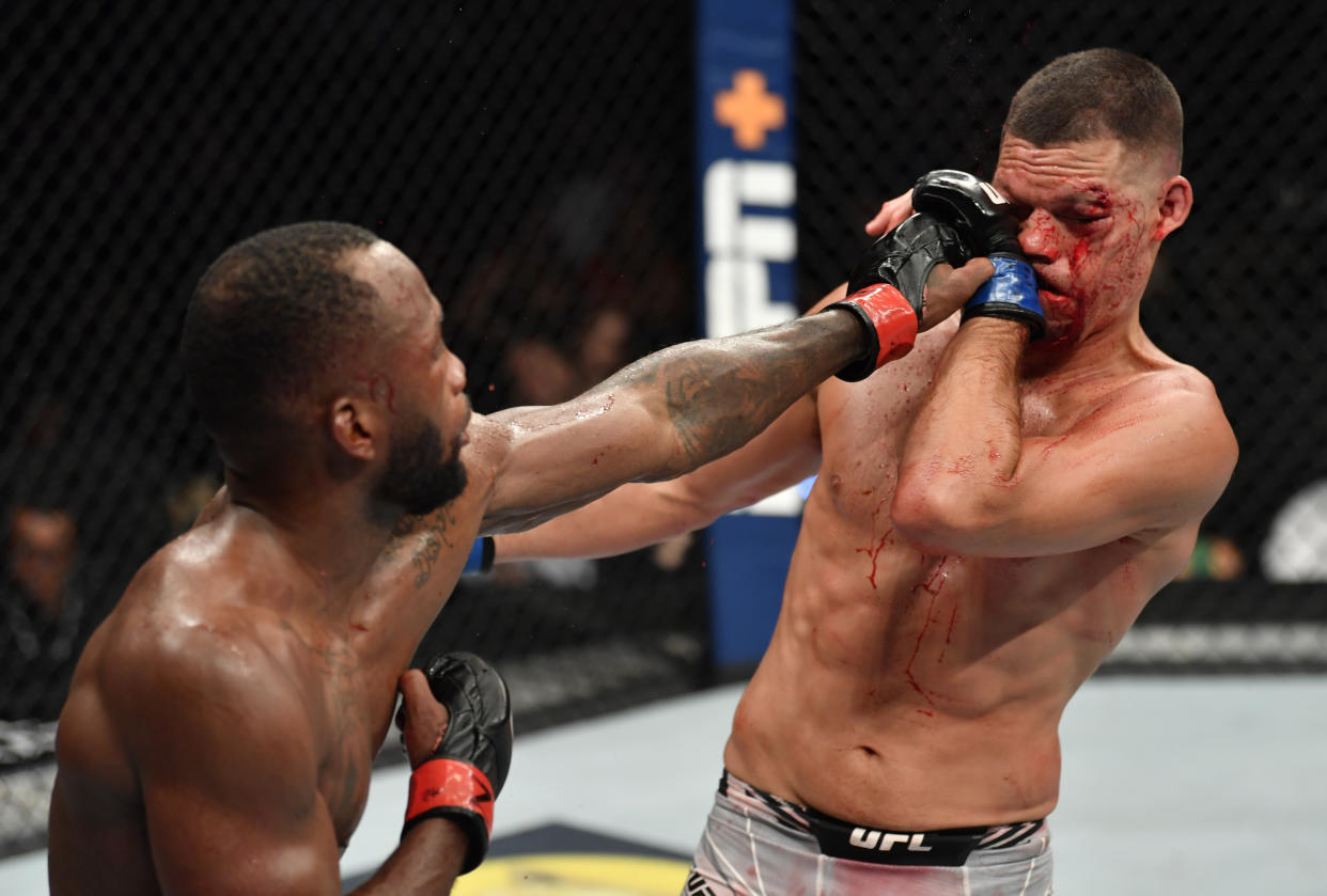 GLENDALE, ARIZONA - JUNE 12: (L-R) Leon Edwards of Jamaica punches Nate Diaz in their welterweight fight during the UFC 263 event at Gila River Arena on June 12, 2021 in Glendale, Arizona. (Photo by Jeff Bottari/Zuffa LLC)