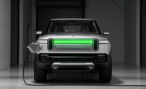 <p>The front end is dominated by two oval-shaped LED light housings and a unibrow-like central light bar (which turns green and "fills up" as the truck is charging), and there's no real grille to be found.</p>