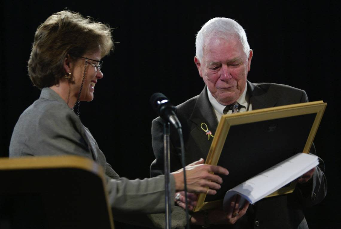 Kathy Lousignont, former FCPS board chair, presented Paul N. Frederick, 78, with the first Veterans Diploma at the School Board Central Office in Lexington Ky., Apr. 21, 2003. Frederick is a WWII Vet that sacrificed graduating high school to serve his country in WWII.