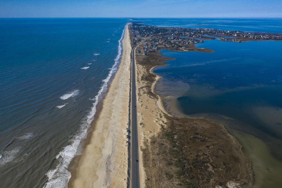 Drone aerial view of Outer Banks Highway 12 with Atlantic Ocean and Sound on both sides, Cape Hatteras National Seashore. / Credit: (Photo by: Visions of America/Joseph Sohm/UCG/Universal Images Group via Getty Images)
