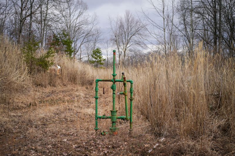 An abandoned natural gas well stands on the property of Hanson Rower in Salyersville