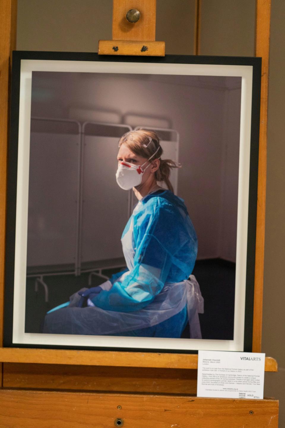 A photograph of nurse Melanie Senior, taken by Johanna Churchill, on display at the Royal London Hospital in London, May 7, 2021, during a visit by Duchess Kate of Cambridge to mark publication of the book "Hold Still," where the photo appears on the cover.