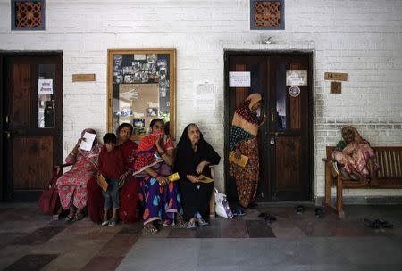 People wait to receive medicine at a clinic supported by Bhopal Medical Appeal for people affected by the 1984 Bhopal gas disaster in Bhopal November 14, 2014. REUTERS/Danish Siddiqui