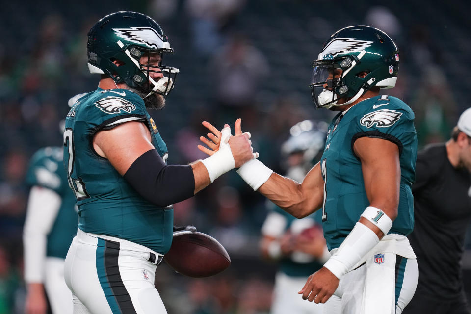 PHILADELPHIA, PENNSYLVANIA - SEPTEMBER 14: Jason Kelce #62 and Jalen Hurts #1 of the Philadelphia Eagles embrace prior to the game against the Minnesota Vikings at Lincoln Financial Field on September 14, 2023 in Philadelphia, Pennsylvania. (Photo by Mitchell Leff/Getty Images)