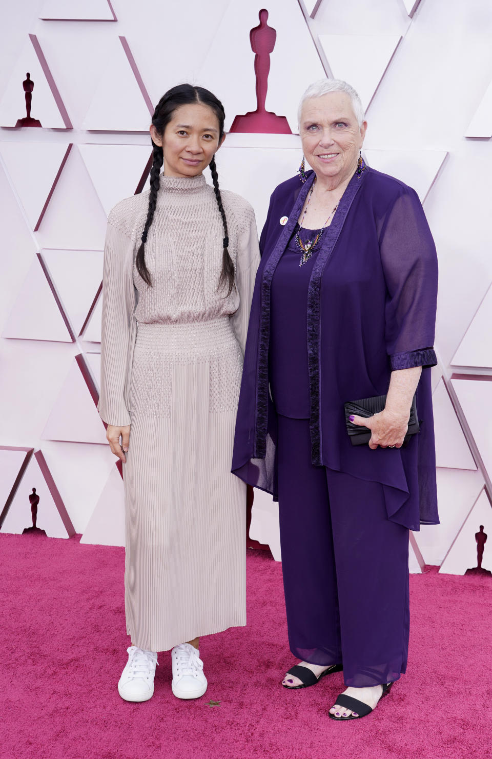 Chloe Zhao, left, and Charlene Swankie arrive at the Oscars on Sunday, April 25, 2021, at Union Station in Los Angeles. (AP Photo/Chris Pizzello, Pool)