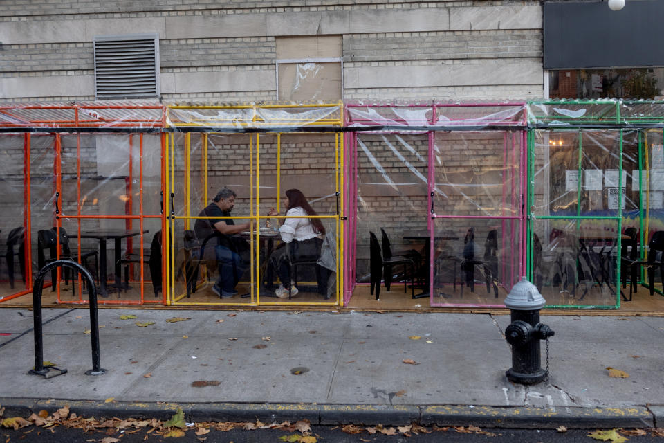 Customer's dine outdoors in individual tents in the West Village on November 26, 2020 in New York City. (Alexi Rosenfeld/Getty Images)