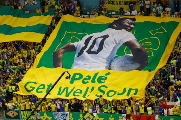 PHOTO: Brazil fans display a banner with an image of former player Pele on it before the a match at the World Cup in Doha, Qatar, on Dec. 2, 2022. (Peter Cziborra/Reuters)