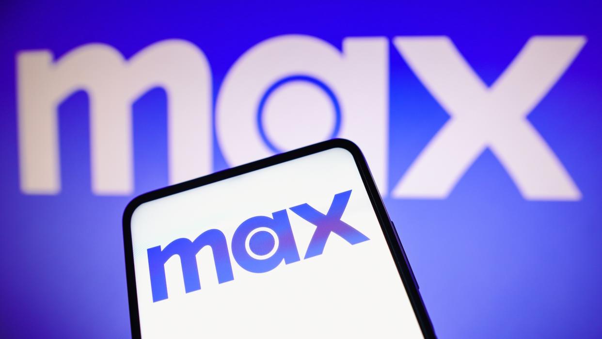  Max streaming service logo on phone with Max logo on a blue background. 