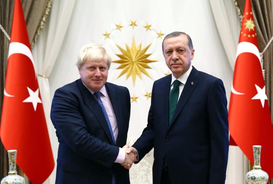 Turkey's President Recep Tayyip Erdogan, right, greets British Foreign Secretary Boris Johnson before a meeting in Ankara, Turkey, Tuesday, Sept. 27, 2016.