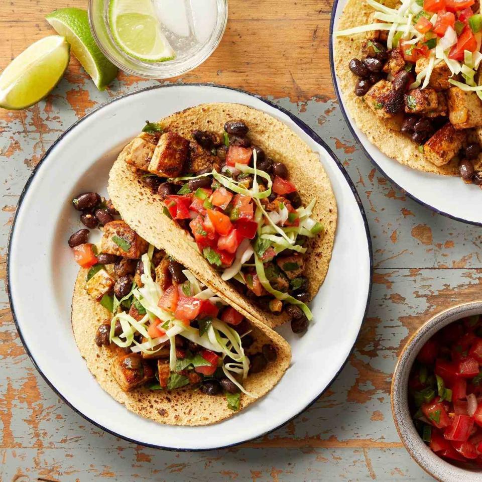 <p>These quick vegan tacos, filled with a spicy tofu filling, make a perfect weeknight dinner. To keep them vegan, top them with shredded cabbage, fresh pico de gallo and guacamole. For vegetarians, add crumbled queso fresco. <a href="https://www.eatingwell.com/recipe/278134/tofu-tacos/" rel="nofollow noopener" target="_blank" data-ylk="slk:View Recipe" class="link ">View Recipe</a></p>