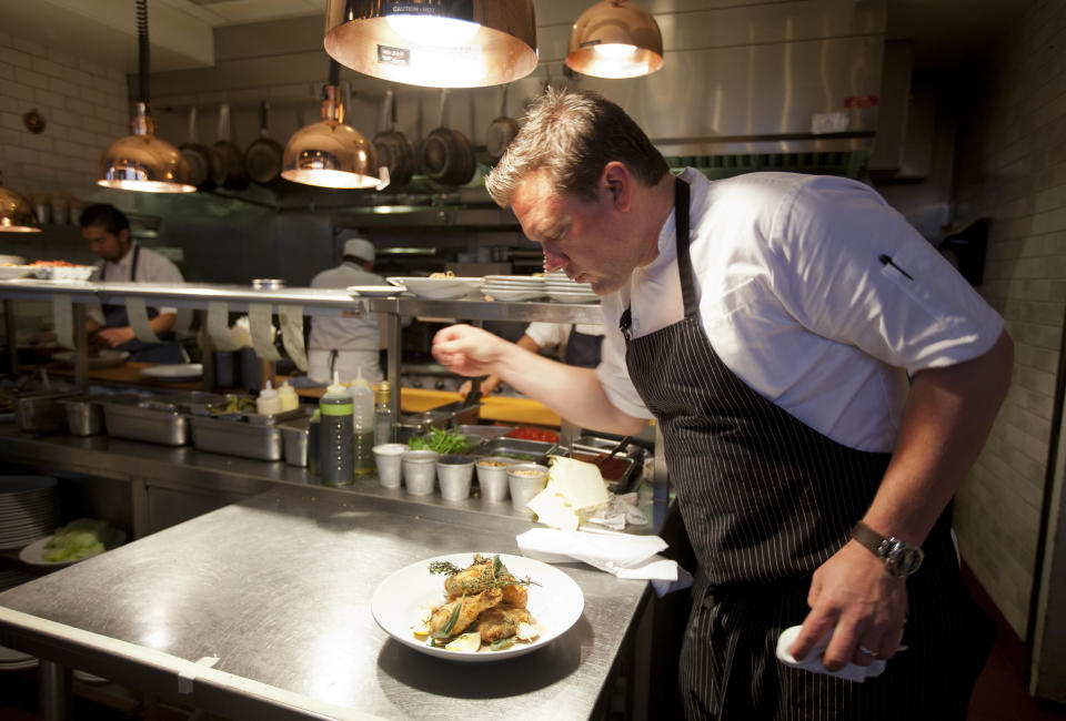 n this photo taken Monday, Oct. 29, 2012, chef Tyler Florence puts a finishing touch to his fried chicken dish in the kitchen at his Wayfare Tavern in San Francisco. Baby food and fried chicken may well be the legacy for which Tyler Florence ultimately is best known. Which seems a bit crazy given his near ubiquity on the Food Network since its earliest days on air, his years of running the celebrity chef gauntlet, his many cookbooks, product lines and appearances. (AP Photo/Eric Risberg)