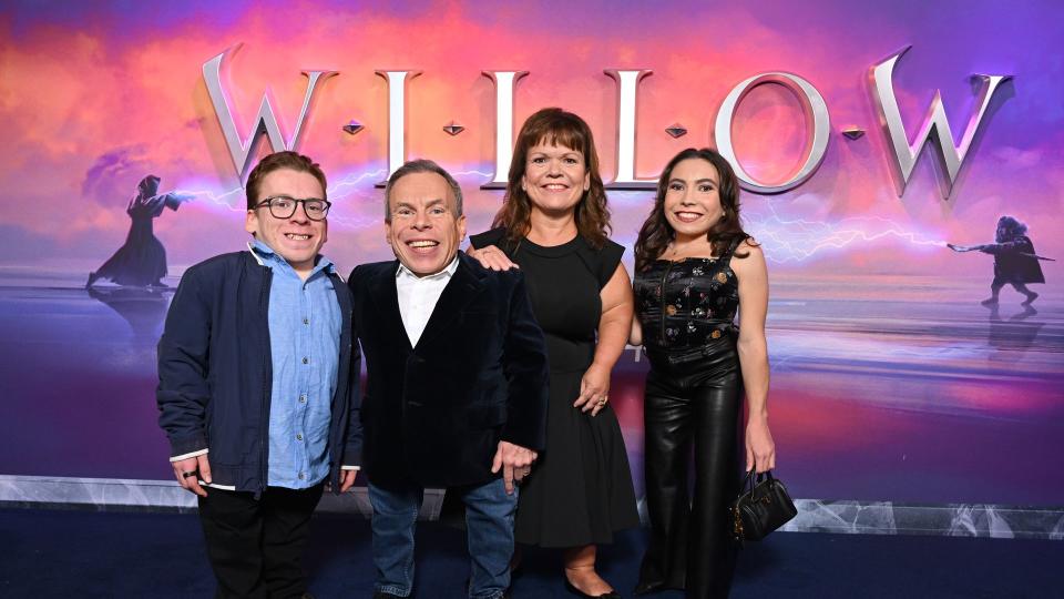 family on blue carpet at screening 