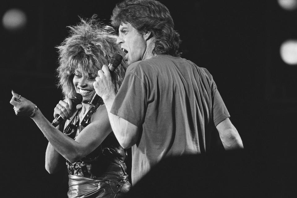 FILE - Singer Tina Turner, left, and Mick Jagger perform together during Live-Aid concert on July 14, 1985, in Philadelphia. Turner, the unstoppable singer and stage performer, died Tuesday, after a long illness at her home in Küsnacht near Zurich, Switzerland, according to her manager. She was 83. (AP Photo/Rusty Kennedy, File)