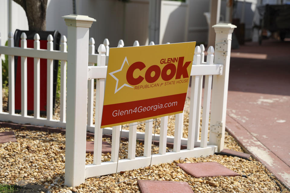 A campaign sign for Georgia Republican state House candidate Glenn Cook is displayed on a fence in Kingsland, Ga., Tuesday, June 11, 2024. (AP Photo/Gary McCullough)