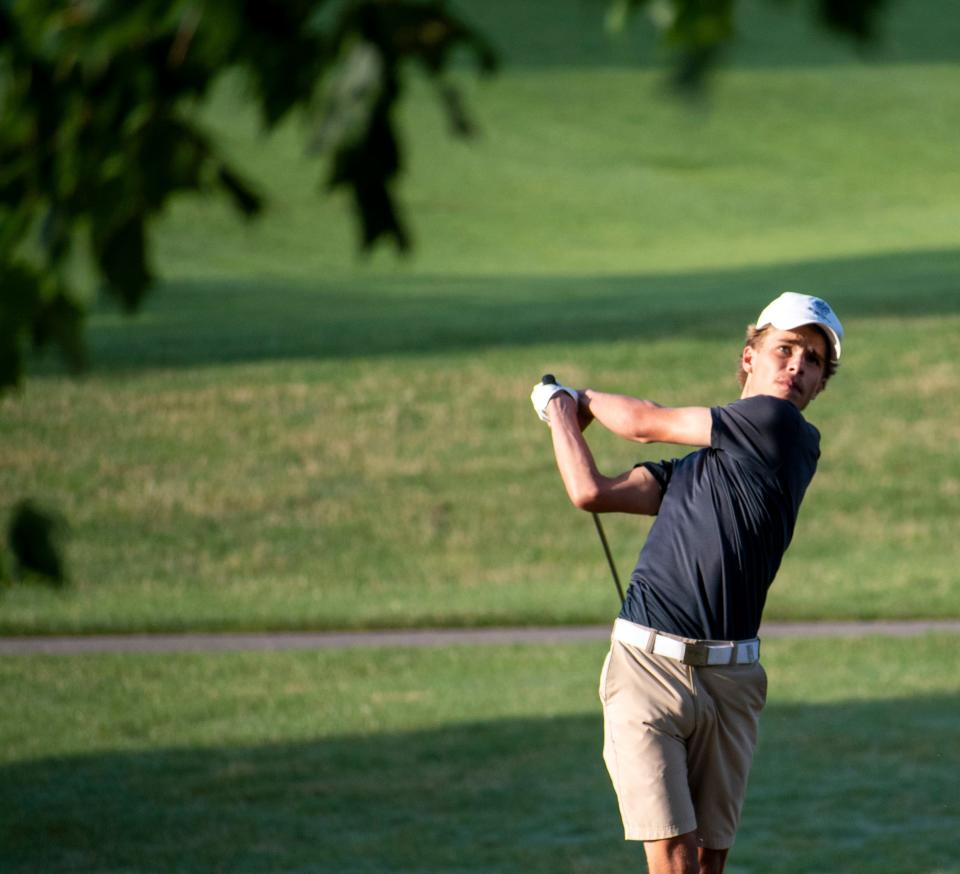 Jacob Paine hits on the third hole at Cascases Golf Course in the Bloomington City Golf Tournament on July 9, 2023