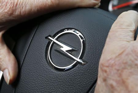 An Opel logo is seen on the steering wheel of a car in Bordeaux, France, February 20, 2017. REUTERS/Regis Duvignau