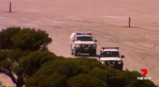 Police rushed to the beach scene. Picture: 7 News