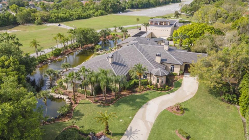 Upscale mansions with hangars, like this .25 million listing in Spruce Creek Fly-In, have become more common in private aviation communities. - Credit: Courtesy Fly-in.com