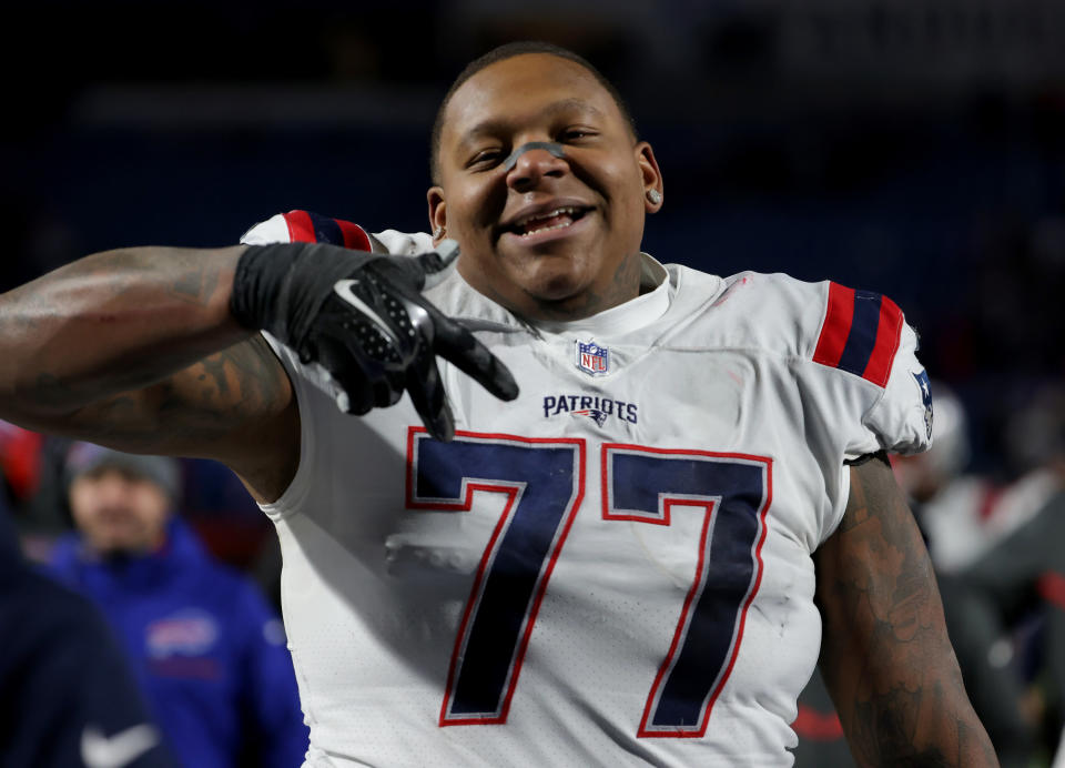 Trent Brown poses for the camera in a Patriots jersey