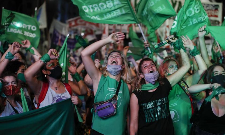 Abortion-rights activists in Buenos Aires celebrate as Argentina’s Congress voted to legalise elective abortion.