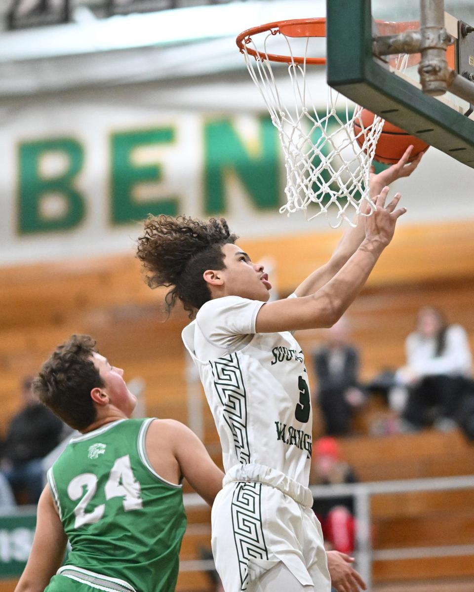 Washington's Steven Reynolds (3) goes up for a shot in front of Bremen’s Silas Laidig (24) Thursday, Jan. 5, 2023, at Washington High School.