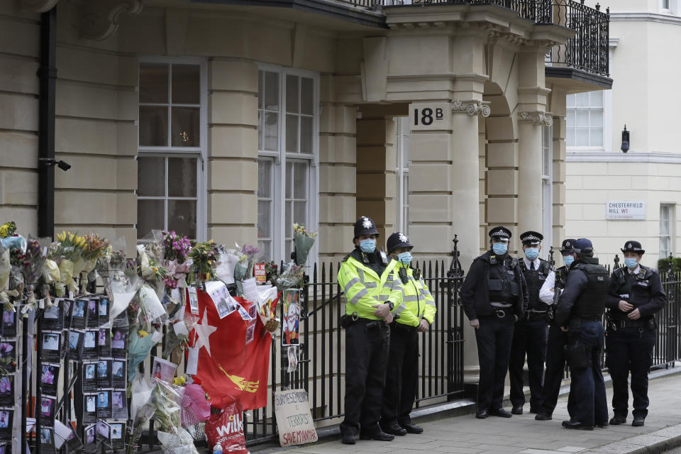 Police officers stand outside the Myanmar Embassy in London, Thursday, April 8, 2021. Newspaper reports say the embassy was taken over by members of the country's new military regime Wednesday evening. (AP Photo/Kirsty Wigglesworth)