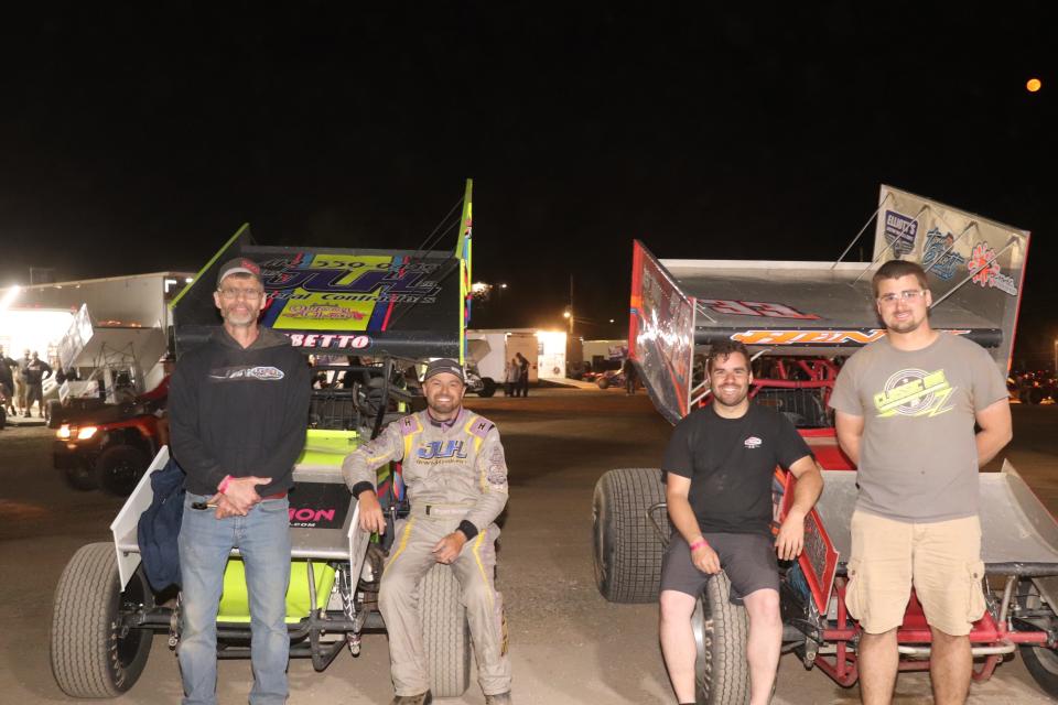 Like father, like son. Crew chief Guy Myers, left, poses with his driver Bryan Sebetto. Driver Cap Henry and his son, crew chief Zack Myers, right. It was the first time father and son won at Fremont Speedway as crew chiefs on the same night in different divisions.