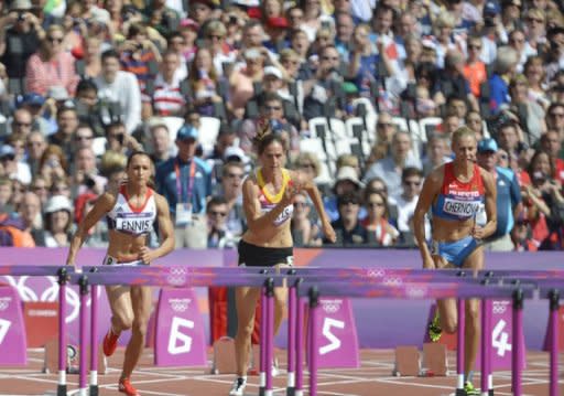 (From left) Britain's Jessica Ennis, Belgium's Sara Aerts and Russia's Tatyana Chernova compete in the women's heptathlon 100m hurdles heats at the athletics event during the London 2012 Olympic Games. Ennis made a flying start to the heptathlon as the London Games athletics programme got under way in front of a vocal, 80,000-capacity Olympic Stadium crowd