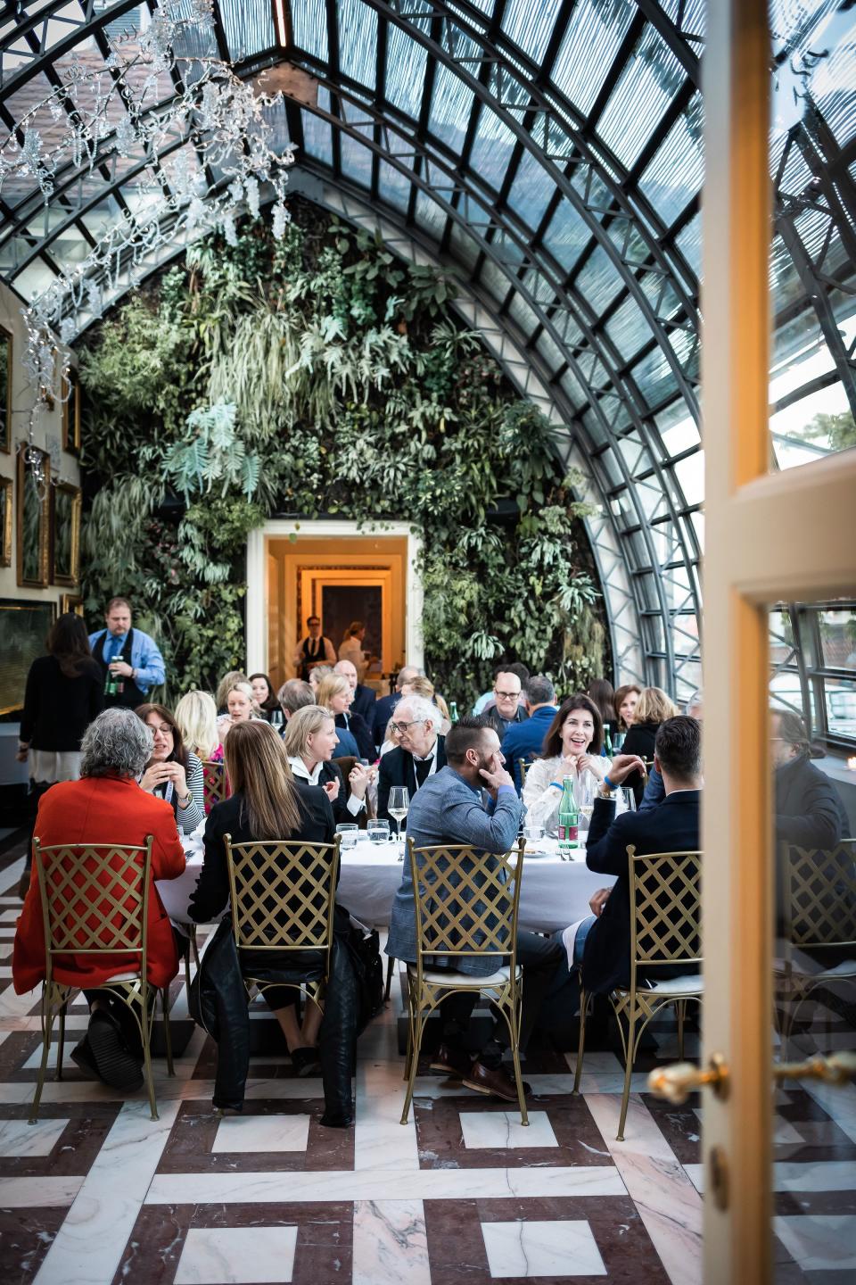 Attendees dine in the Nelahozeves Castle courtyard following a morning session of "Czech University," featuring lessons in traditional Bohemian dance, Czech holiday table decorating, and a tour of the castle.