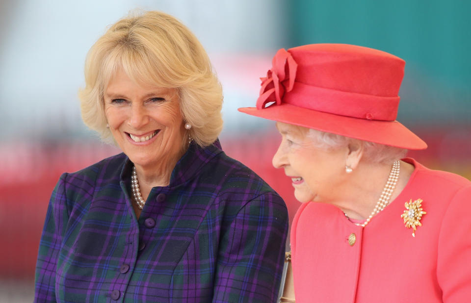 LONDON, ENGLAND - OCTOBER 29:  Queen Elizabeth II and Camilla, Duchess of Cornwall share a joke as they visit Ebony Horse Club & Community Riding Centre in Brixton during a joint visit on October 29, 2013 in London, England.  (Photo by Chris Jackson/Getty Images)