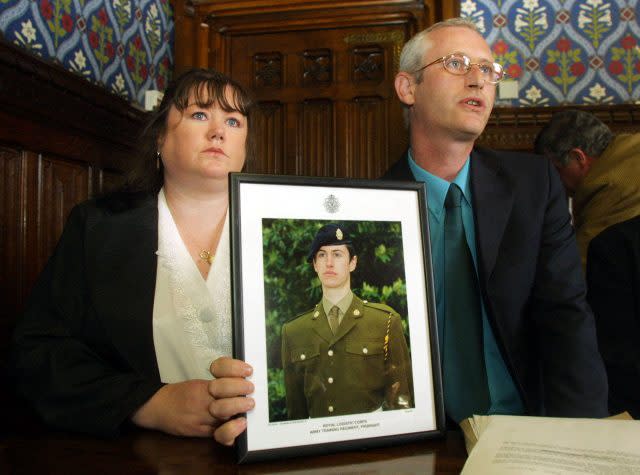 Diane and Geoff Gray with a photo of their dead son Geoff. (Peter Jordan/PA)