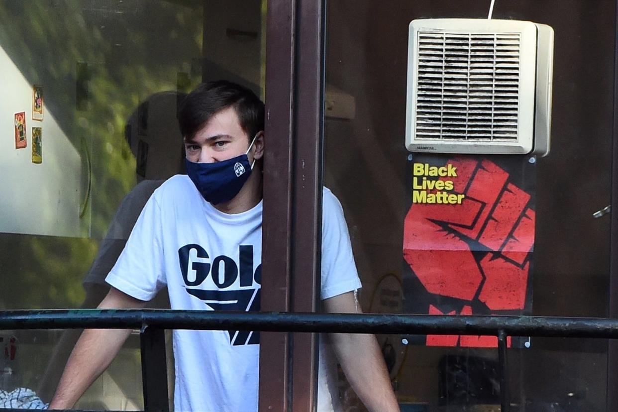 First year student Issac Quinn who has tested positive for Covid-19 and is self isolating with his flatmates: AFP via Getty Images