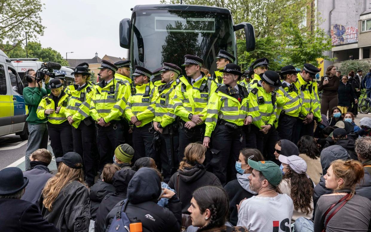 Officers guard the bus