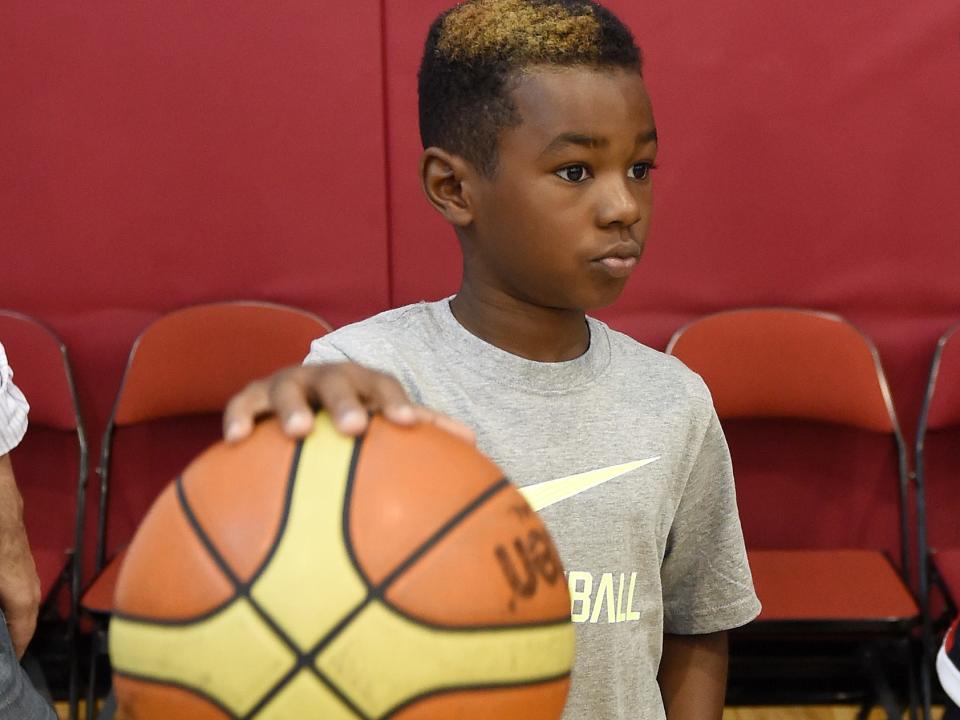 Bryce James, son of LeBron James #27 of the 2015 USA Basketball Men's National Team, dribbles a ball during a practice session at the Mendenhall Center on August 12, 2015