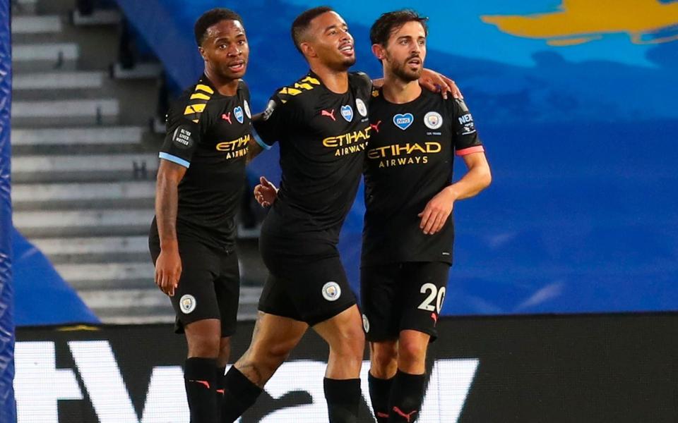 Manchester City's Bernardo Silva (R) celebrates after scoring for a 4-0 lead with Manchester City's Raheem Sterling - Shutterstock