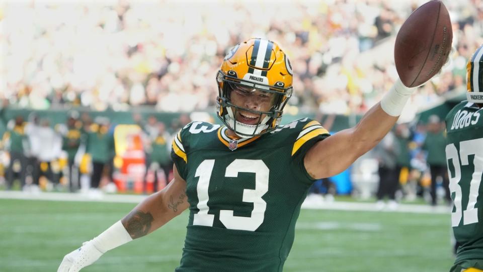 Oct 9, 2022;  London, United Kingdom;  Green Bay Packers wide receiver Allen Lazard (13) celebrates after scoring a touchdown in the first quarter against the New York Giants during an NFL International Series game at Tottenham Hotspur Stadium.