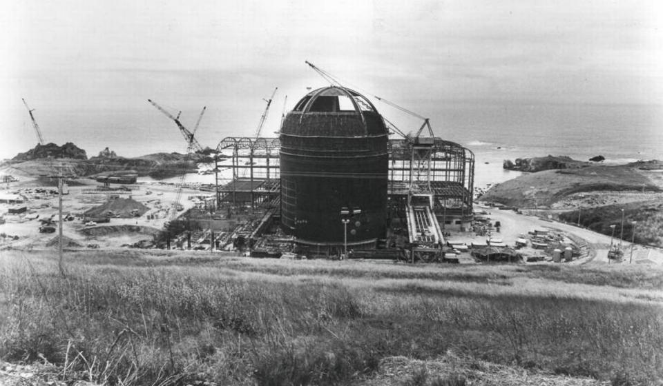 The pressurized-water reactor for Unit 1 takes shape at the foot of Diablo Canyon overlooking the cove and the Pacific in a photo taken May 11, 1971. PG&E’s turbine generators would be located in the building under construction at the rear.