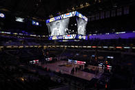 The Indiana Pacers have a moment of silence for Bobby "Slick" Leonard before an NBA basketball game between the Indiana Pacers and the Los Angeles Clippers, Tuesday, April 13, 2021, in Indianapolis. The Indiana Pacers announced that the man who led them to three ABA championships during a Hall of Fame coaching career and was selected a 1963 NBA All-Star had died. (AP Photo/Darron Cummings)