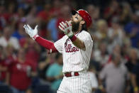 Philadelphia Phillies' Brandon Marsh, right, reacts after hitting a home run against Atlanta Braves pitcher Jackson Stephens during the fifth inning of the second baseball game in a doubleheader, Monday, Sept. 11, 2023, in Philadelphia. (AP Photo/Matt Slocum)