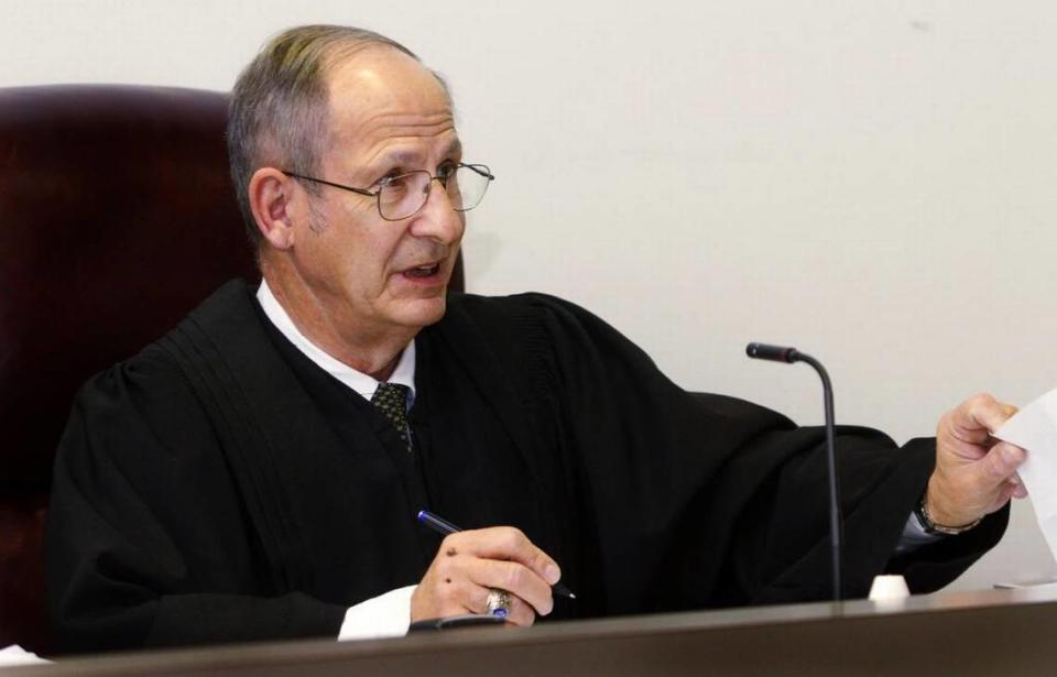 Judge Michael P. Cielinski handles paperwork between sessions of Recorder’s Court on Feb. 17, 2011.