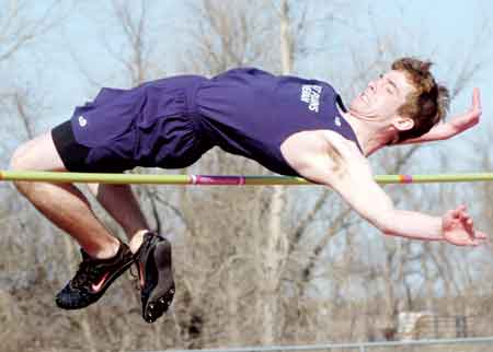 Great Plains Lutheran’s Zack Feil strains to clear the bar during the boys’ high jump at the 2009 Pork Chop Relays track and field meet in Clear Lake. Feil cleared 6 feet to win the event and also took the boys’ long jump.