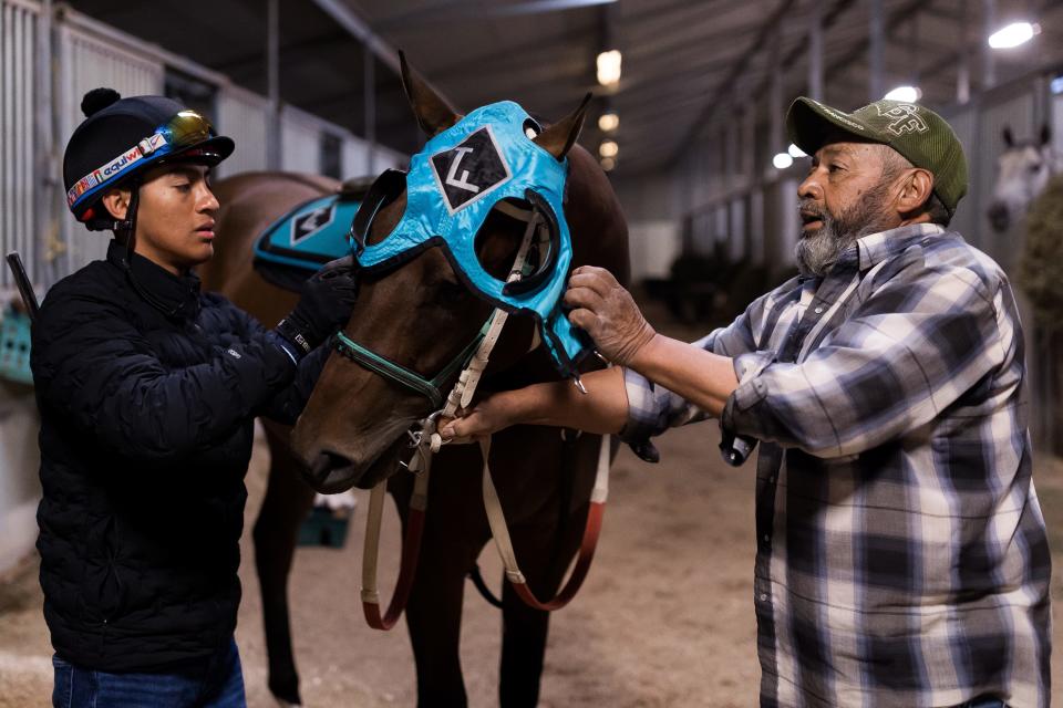 El Paso jockey Luis Fuentes prepares his horse to head to the Sunland Park Racetrack on Tuesday, March 21, 2023. Fuentes is the top thoroughbred jockey at Sunland Park Racetrack & Casino.