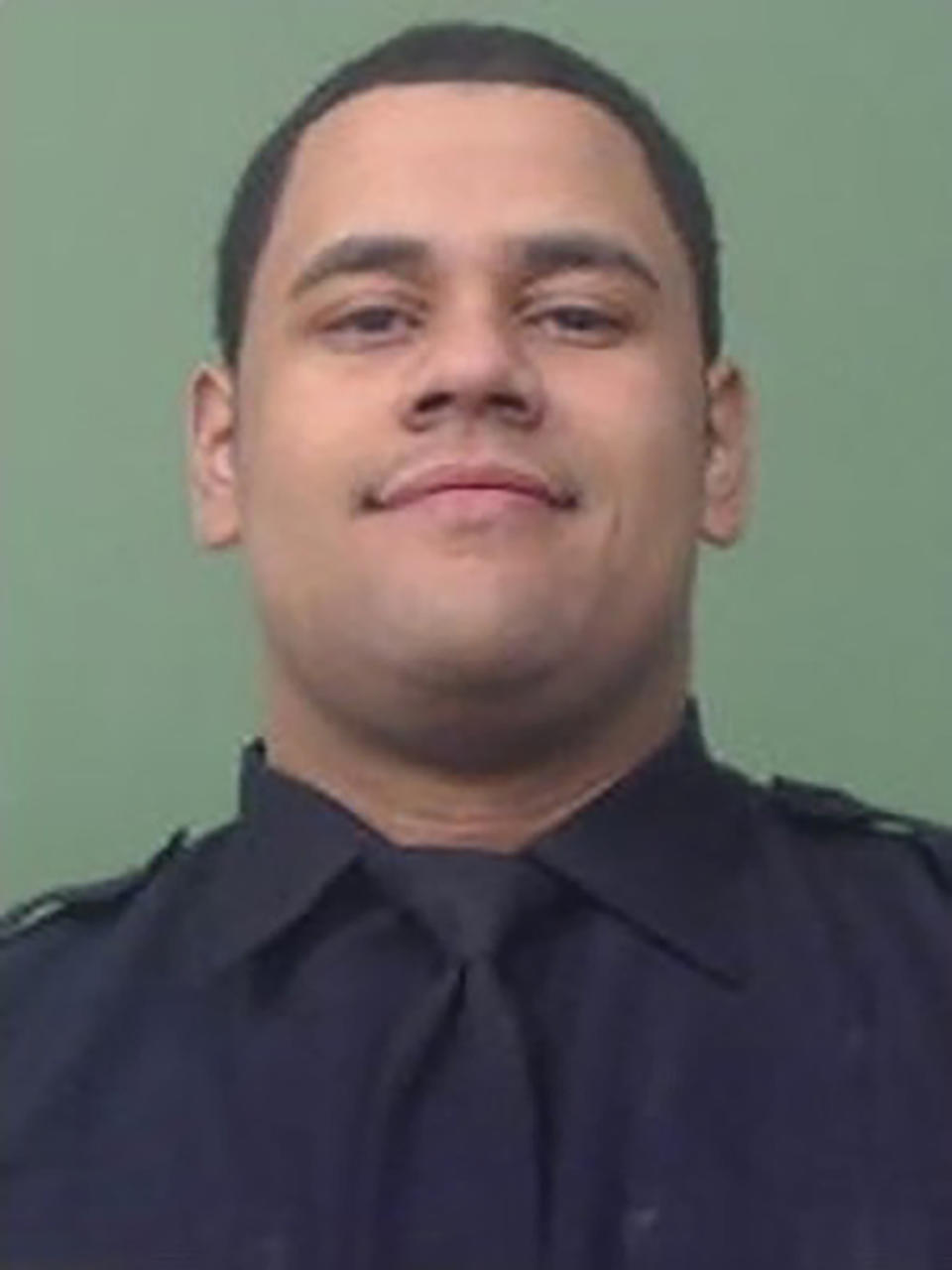 In an undated photo provided by the New York City Police Department, NYPD Officer Wilbert Mora, who was involved in a police shooting, Friday, Jan. 21, 2022, in New York City, is shown. Officials say Mora, 27, was critically wounded while fellow officer Jason Rivera, 22, was killed in a shooting in the Harlem neighborhood of New York. The officers had been responding to a call Friday about an argument between a woman and her adult son. (Courtesy of NYPD via AP)