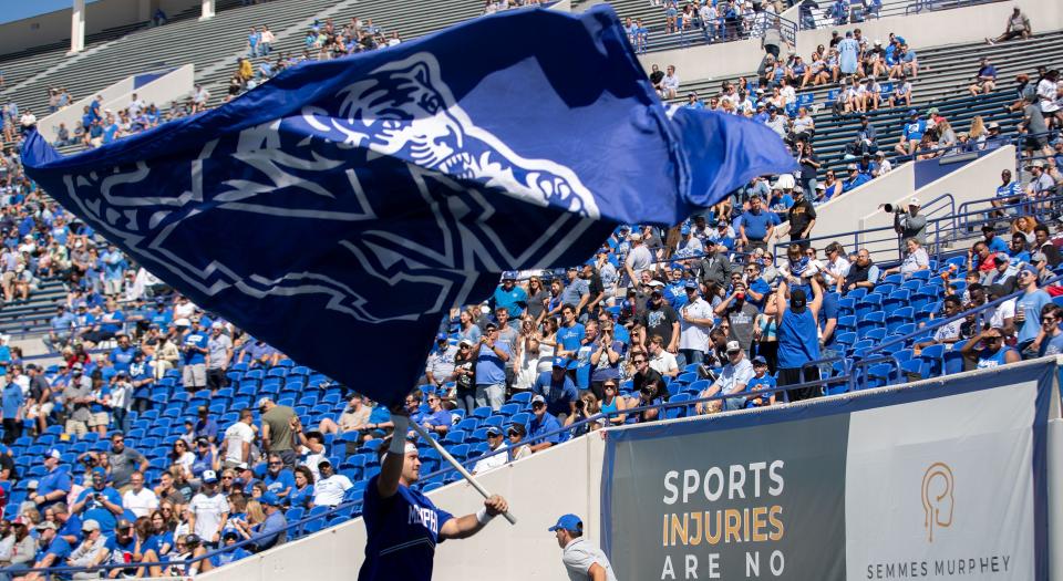 Memphis Tigers fans celebrate after their team scores a touchdown during a  game against the Temple Owls on Saturday, Oct. 1, 2022, at Simmons Bank Liberty Stadium. The Tigers defeated the Owls 24-3.