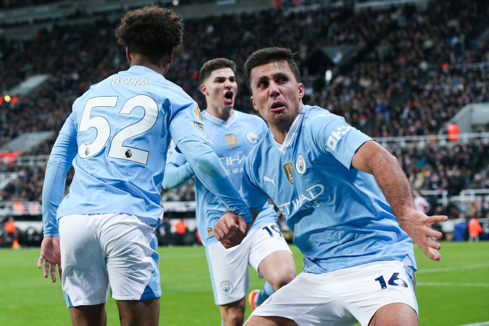 NEWCASTLE UPON TYNE, ENGLAND - JANUARY 13: Oscar Bobb of Manchester City celebrates his side's third goal with Julian Alvarez and Rodri during the Premier League match between Newcastle United and Manchester City at St. James Park on January 13, 2024 in Newcastle upon Tyne, England. (Photo by James Gill - Danehouse/Getty Images)