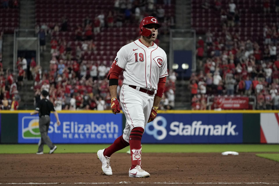 Cincinnati Reds' Joey Votto (19) rounds the bases after hitting a two-run home run during the fifth inning of a baseball game against the Miami Marlins, Friday, Aug. 20, 2021, in Cincinnati. (AP Photo/Jeff Dean)