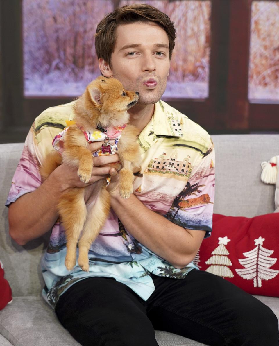 Patrick Schwarzenegger cozies up to a pup on the set of <em>Despierta América!</em> at Univision Studios in Miami on Friday to promote the film <em>Daniel Isn't Real. </em>