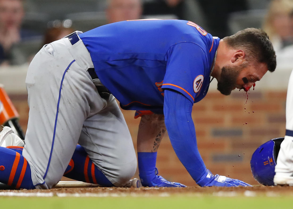 Kevin Pillar of the New York Mets after he was hit by a pitch in the face in Atlanta