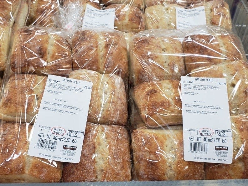 stack of clear bags of kirkland's artisan rolls at costco